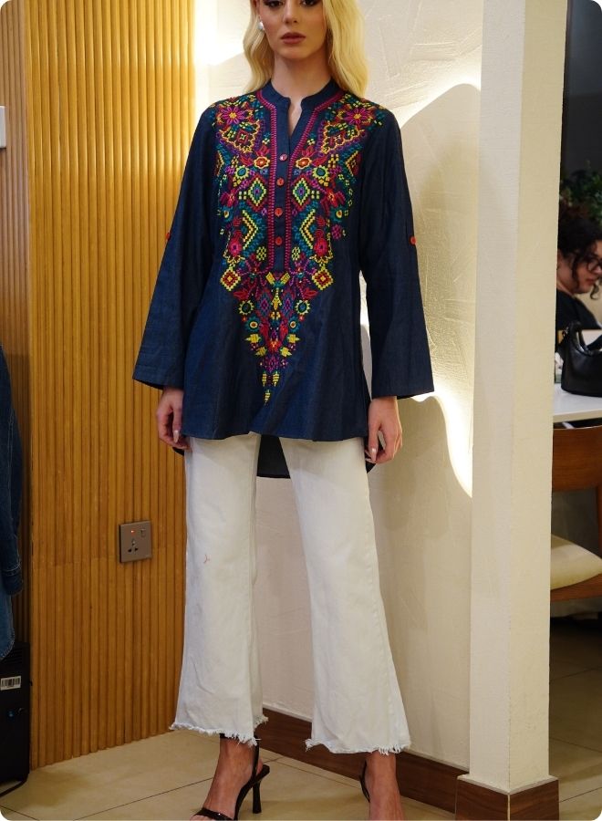 Featuring denim blue tunic with multi coloured thread embrodery