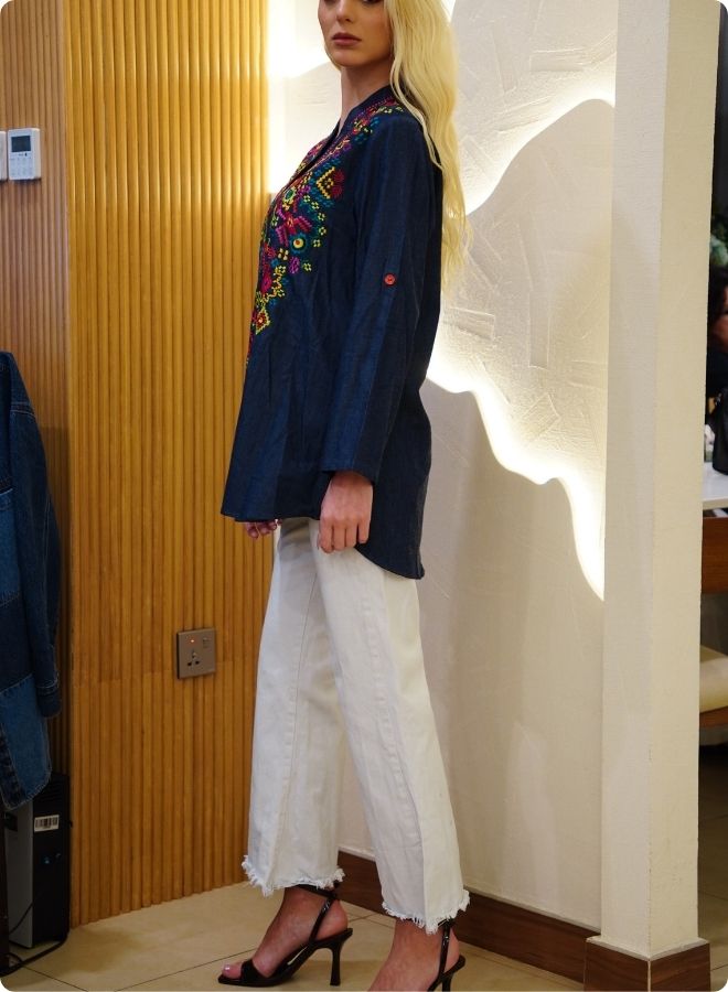Featuring denim blue tunic with multi coloured thread embrodery