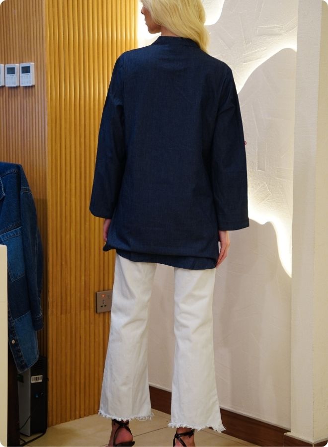 Featuring denim blue tunic with multi coloured thread embrodery