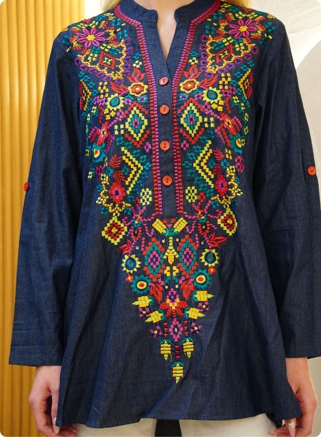 Featuring denim blue tunic with multi coloured thread embrodery