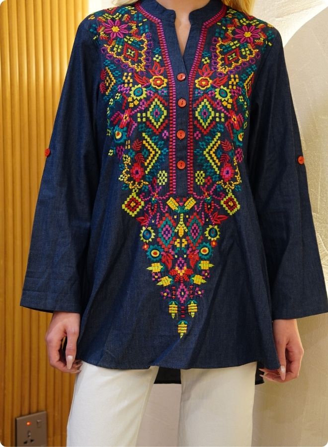 Featuring denim blue tunic with multi coloured thread embrodery
