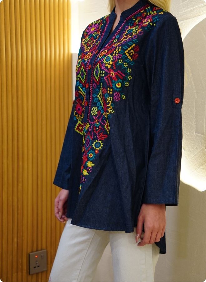 Featuring denim blue tunic with multi coloured thread embrodery