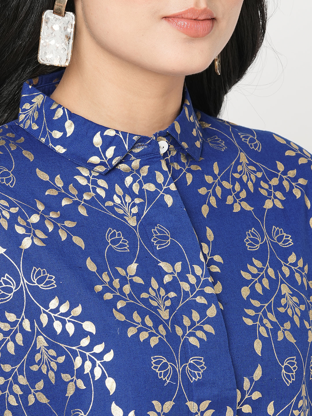 #Be Abhinaya Featuring a foliage gold print confort fit shirt with drop shoulder that moves from Nine to wine