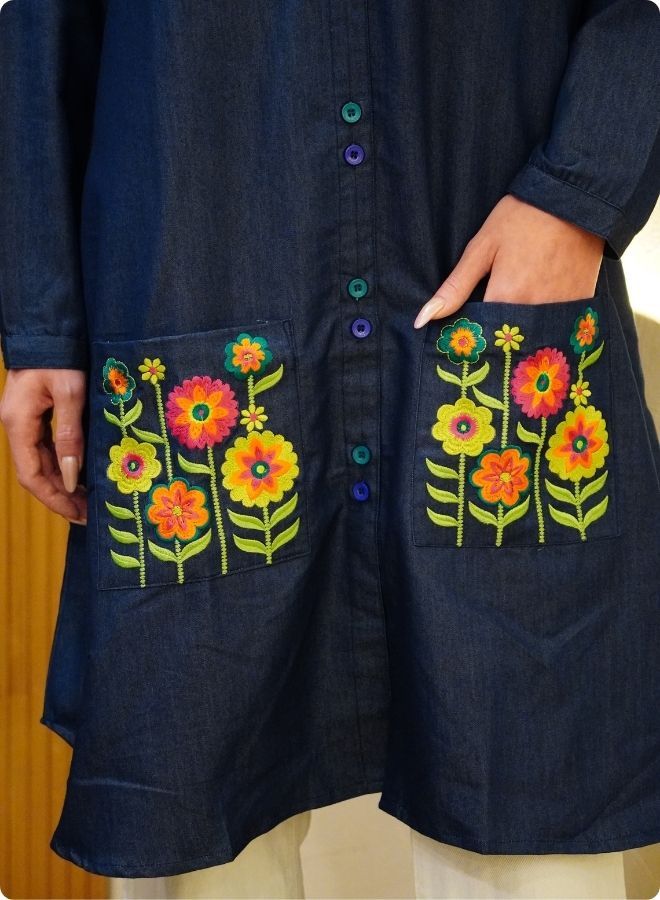 Featuring soft denim with front button shirt dress and embroidered pockets