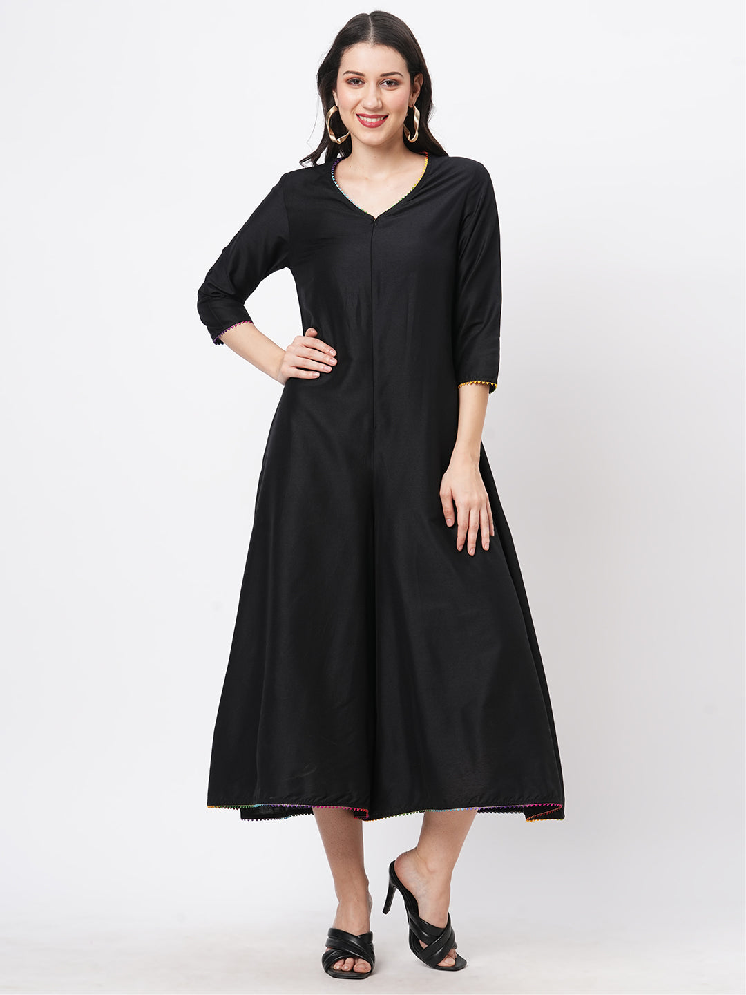 Featuring A Black Silk Blend Below Calf Jumpsuit With Multi Color Trim At The Neck And Sleeve Hem