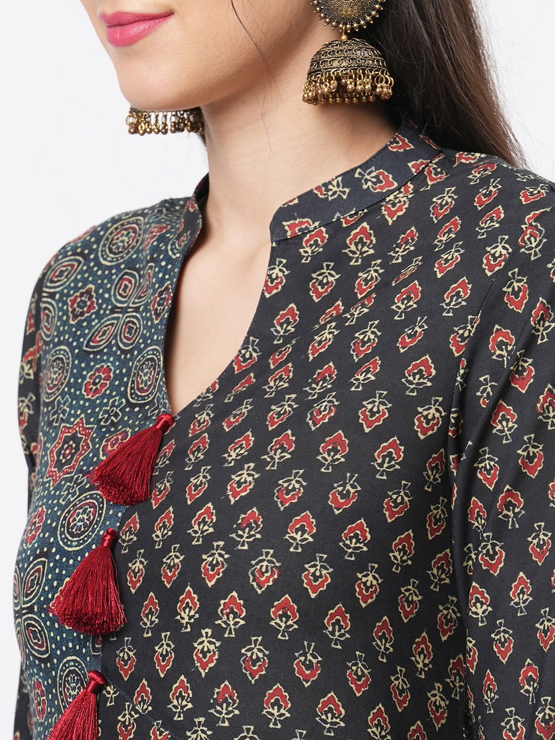 Forest Green Two Print Long Flared Kurta Complimenting Each Other With Contrast Color Tassel At The Neck.