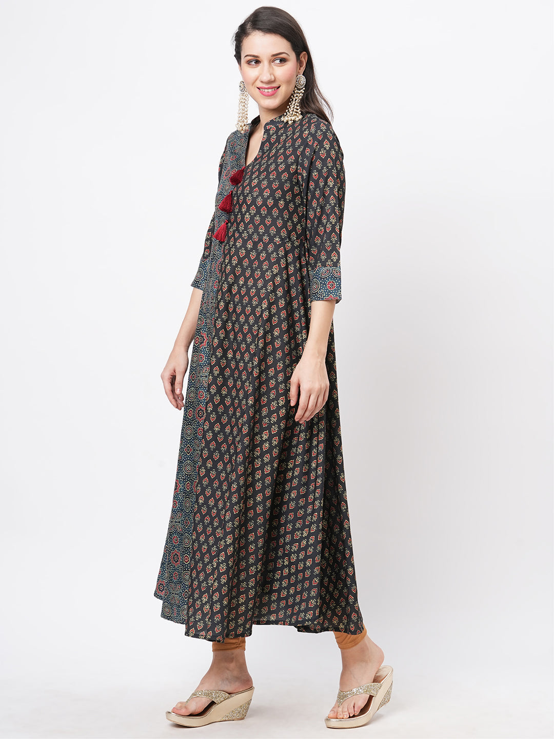 Forest Green Two Print Long Flared Kurta Complimenting Each Other With Contrast Color Tassel At The Neck.