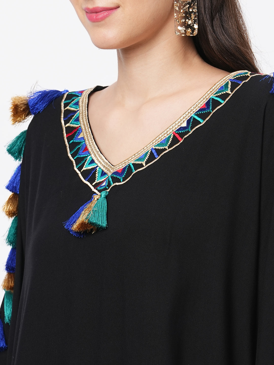 #Be featuring a black kaftan in viscose base with multi color tassel detailing