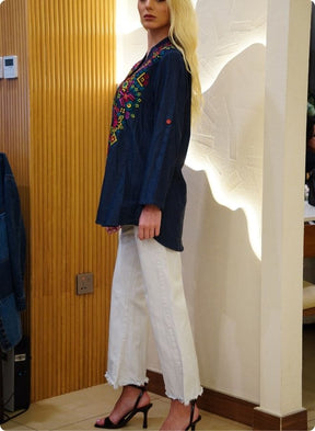 Featuring denim blue tunic with multi coloured thread embrodery