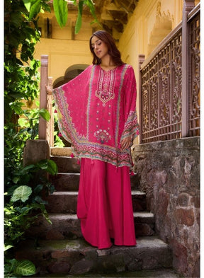 Vibrant Fuchsia Ethnic Wear Against Traditional Indian Architecture
