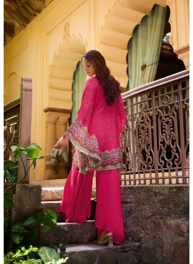 Vibrant Fuchsia Ethnic Wear Against Traditional Indian Architecture