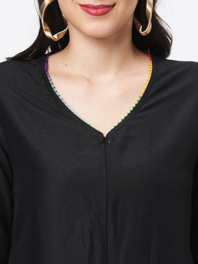 Featuring A Black Silk Blend Below Calf Jumpsuit With Multi Color Trim At The Neck And Sleeve Hem