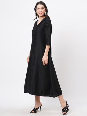 Featuring A Black Silk Blend Below Calf Jumpsuit With Multi Color Trim At The Neck And Sleeve Hem