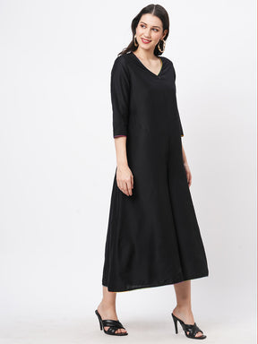 Featuring A Black Silk Blend Below Calf Jumpsuit With Multi Color Trim At The Neck And Sleeve Hem