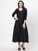 Featuring A Black Silk Blend Below Calf Jumpsuit With Multi Color Trim At The Neck And Sleeve Hem