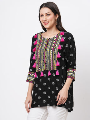 Boho-Chic Black Printed Tunic With Contrast Embroidered Linear Yoke And Fuschia Pink Tassels