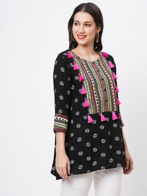 Boho-Chic Black Printed Tunic With Contrast Embroidered Linear Yoke And Fuschia Pink Tassels